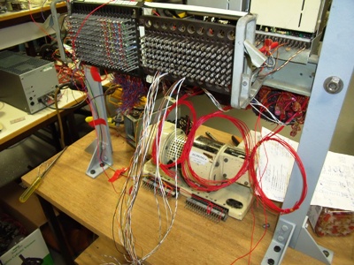 picture showing the rear of the unit where the p wire and voice circuits are being wired via a patch panel